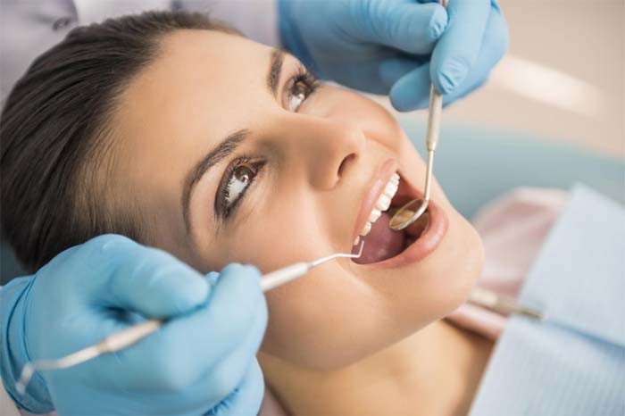 Woman undergoing dental treatment