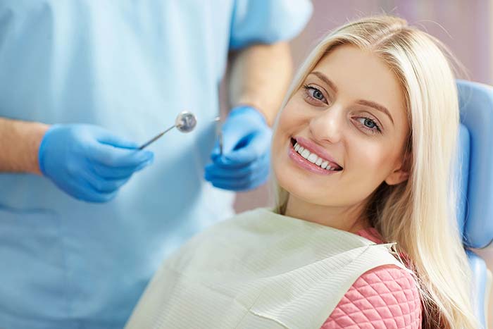 Girl at the dental clinic smiling