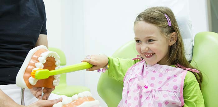 Small girl at the dental clinic